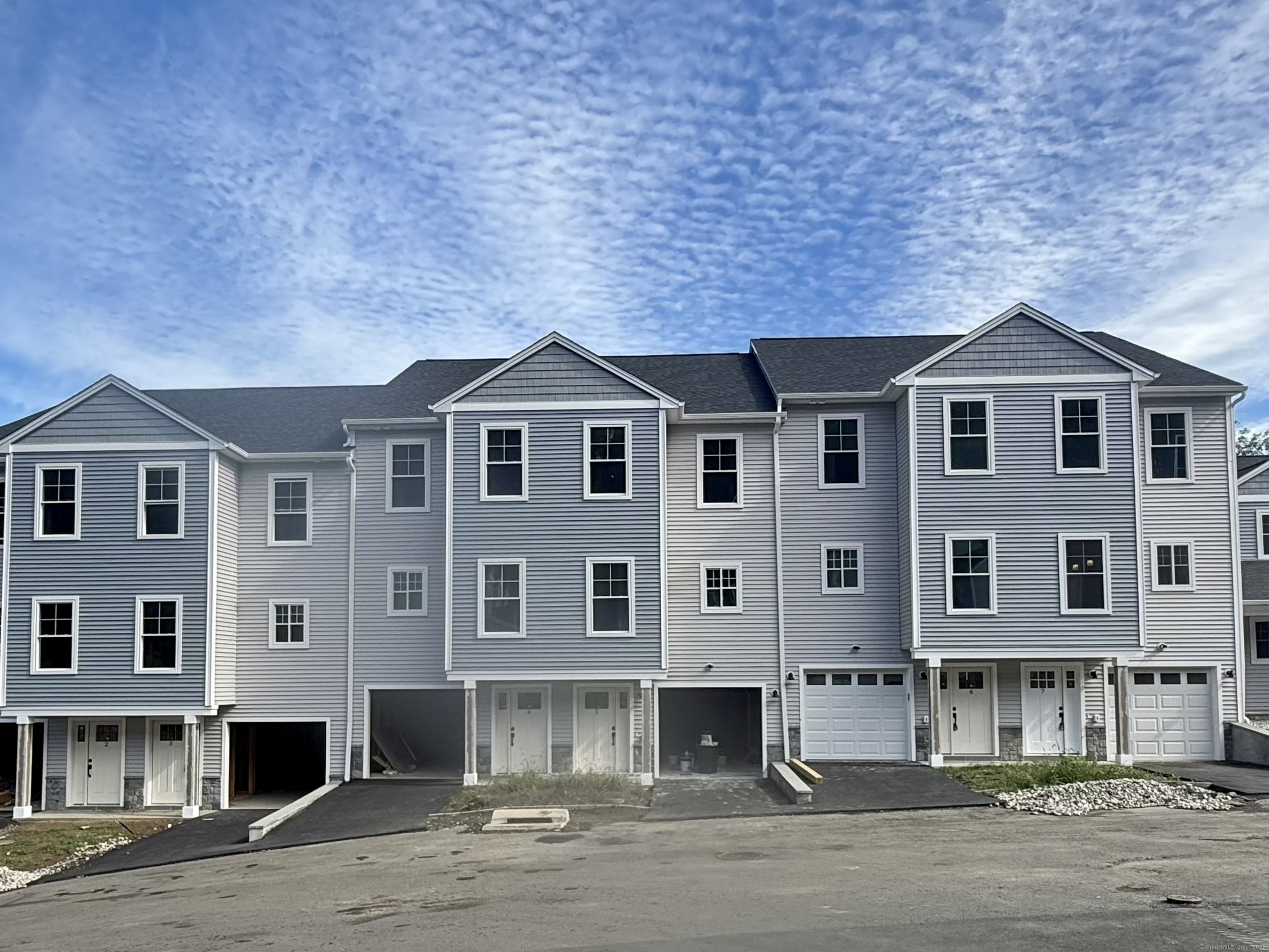 4 Windward Way, Unit 4 Waterford, CT 06385 - Photo 1 of 1 a front view of a house with a yard