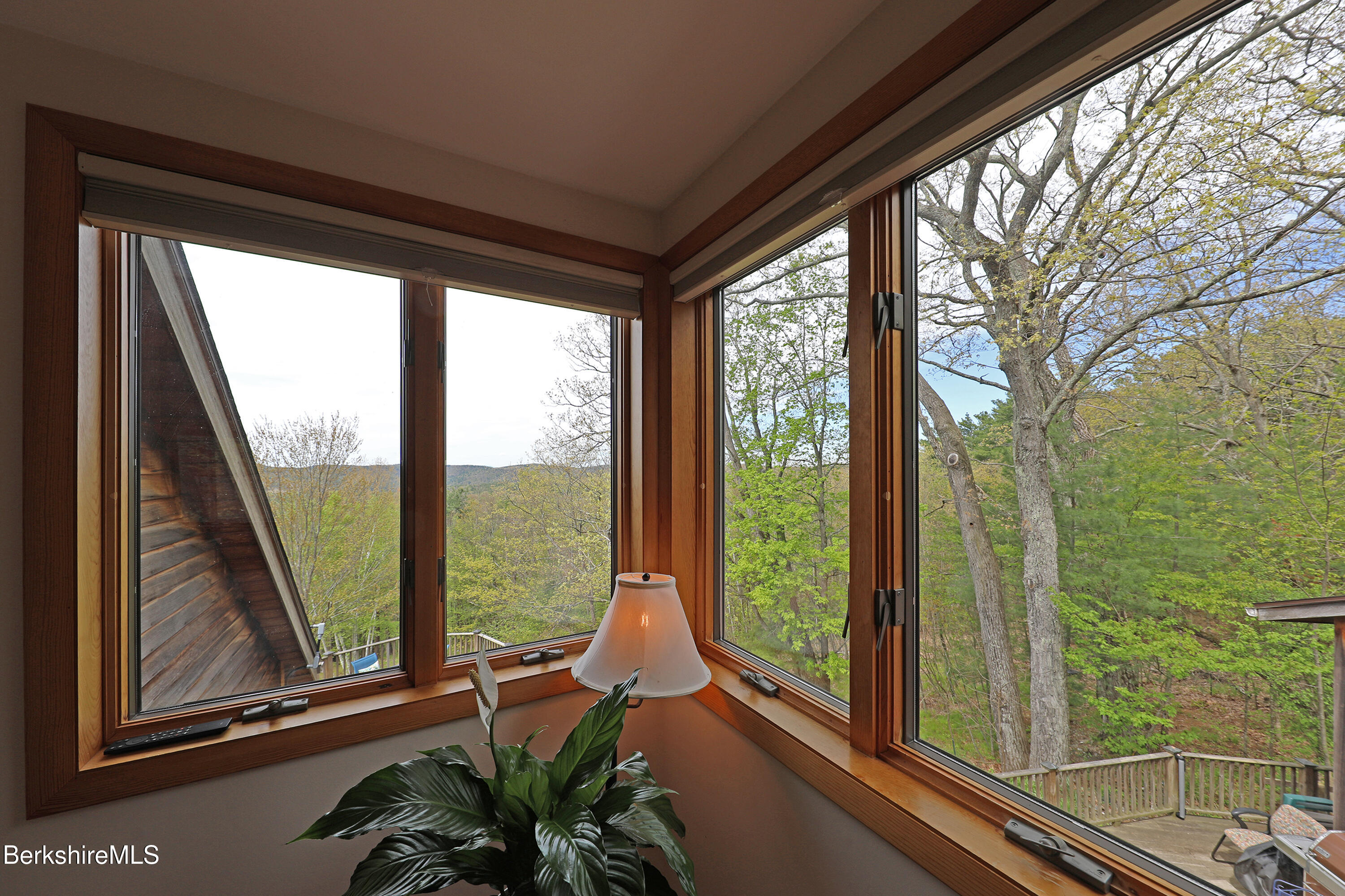 126 Temple Road New Lebanon, NY 12125 - Photo 16 of 37 a view of a balcony with furniture and floor to ceiling window