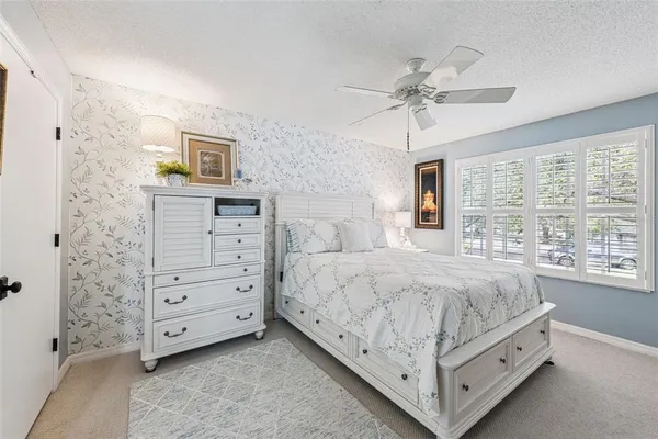 a view of a hallway with paintings on the wall