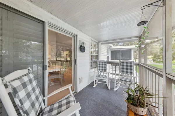 a view of a chairs and table in a patio