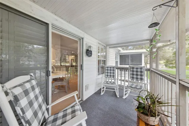 a view of a chairs and table in a patio