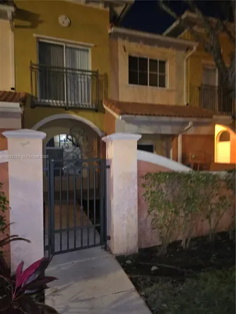 a front view of a house with parking