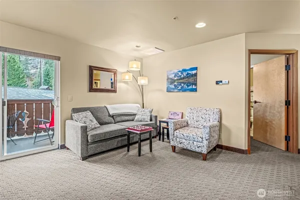 a living room with furniture and a gate