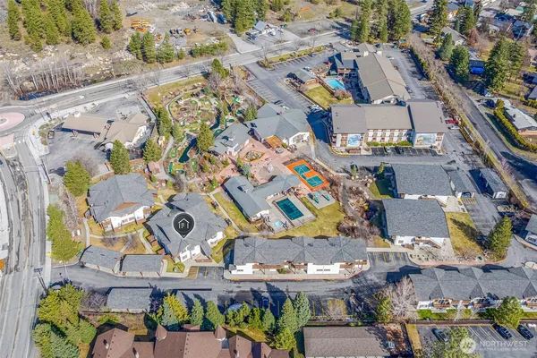 an aerial view of residential houses and outdoor space