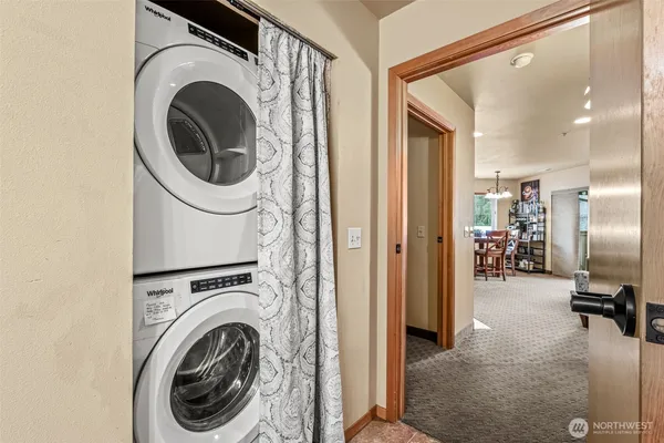 a view of a hallway with washer and dryer