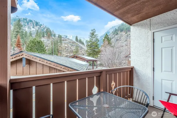 a view of a balcony with furniture