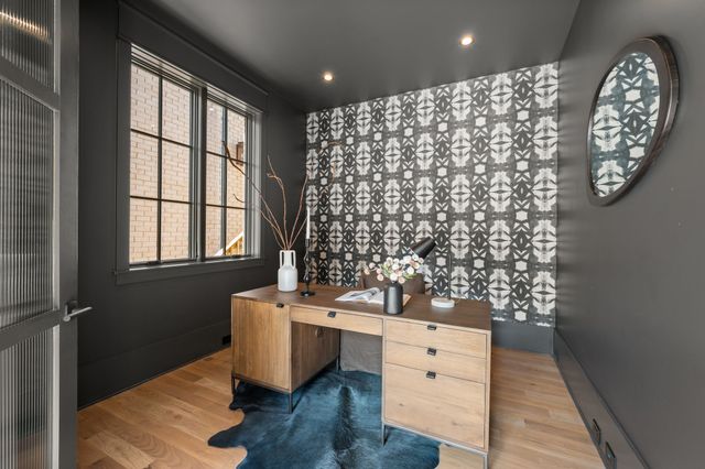 a view of a dining room with furniture window and wooden floor