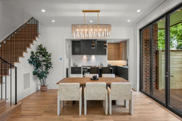 a kitchen with a table and chairs