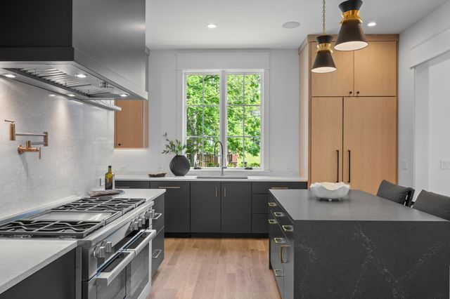 a view of a dining room and hall with wooden floor