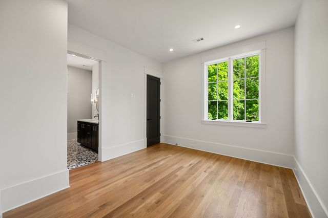 a view of balcony with wooden floor and trees in the background