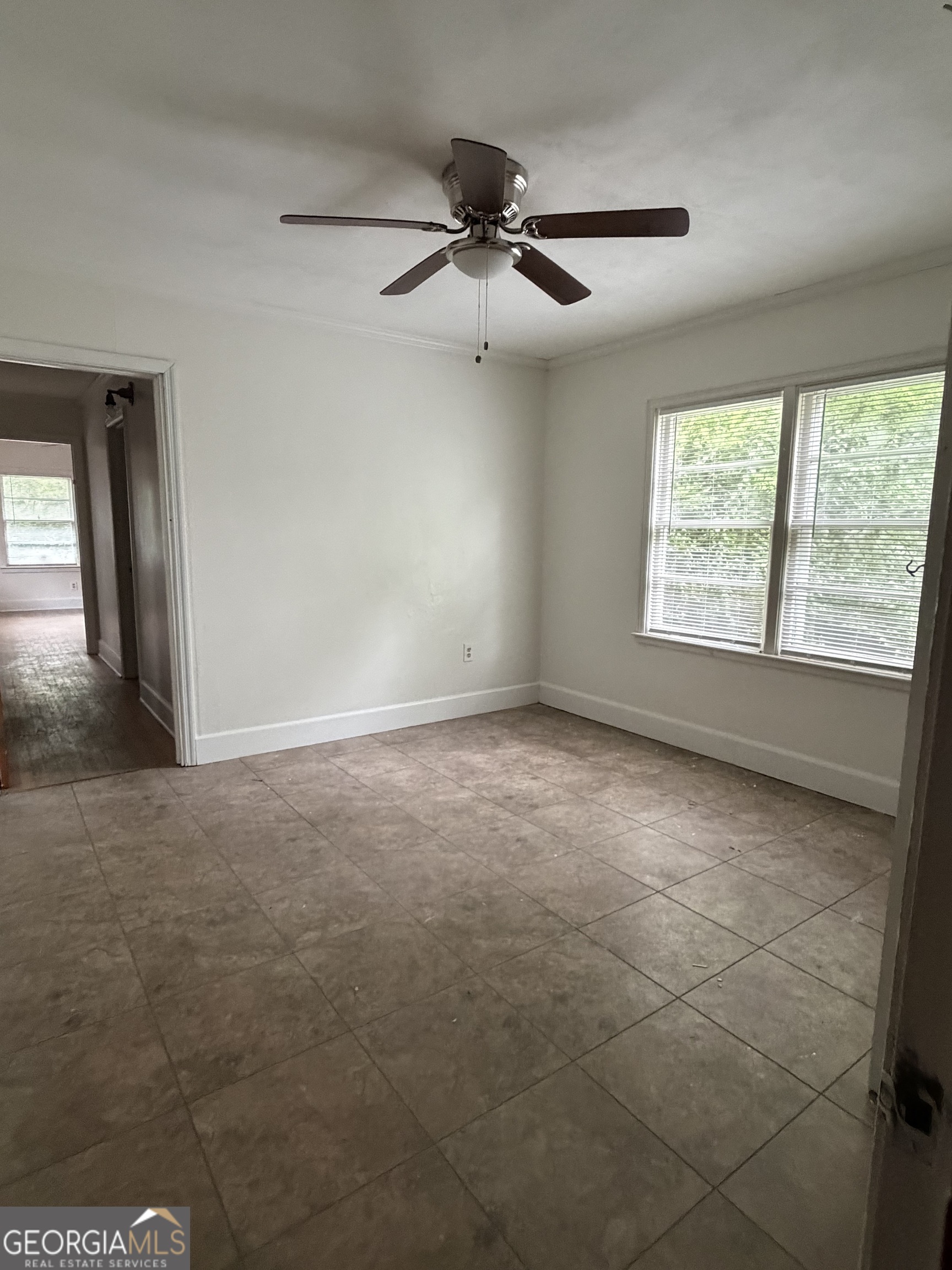 225 West Jessamine Street Fitzgerald, GA 31750 - Photo 24 of 39 a view of an empty room with a window