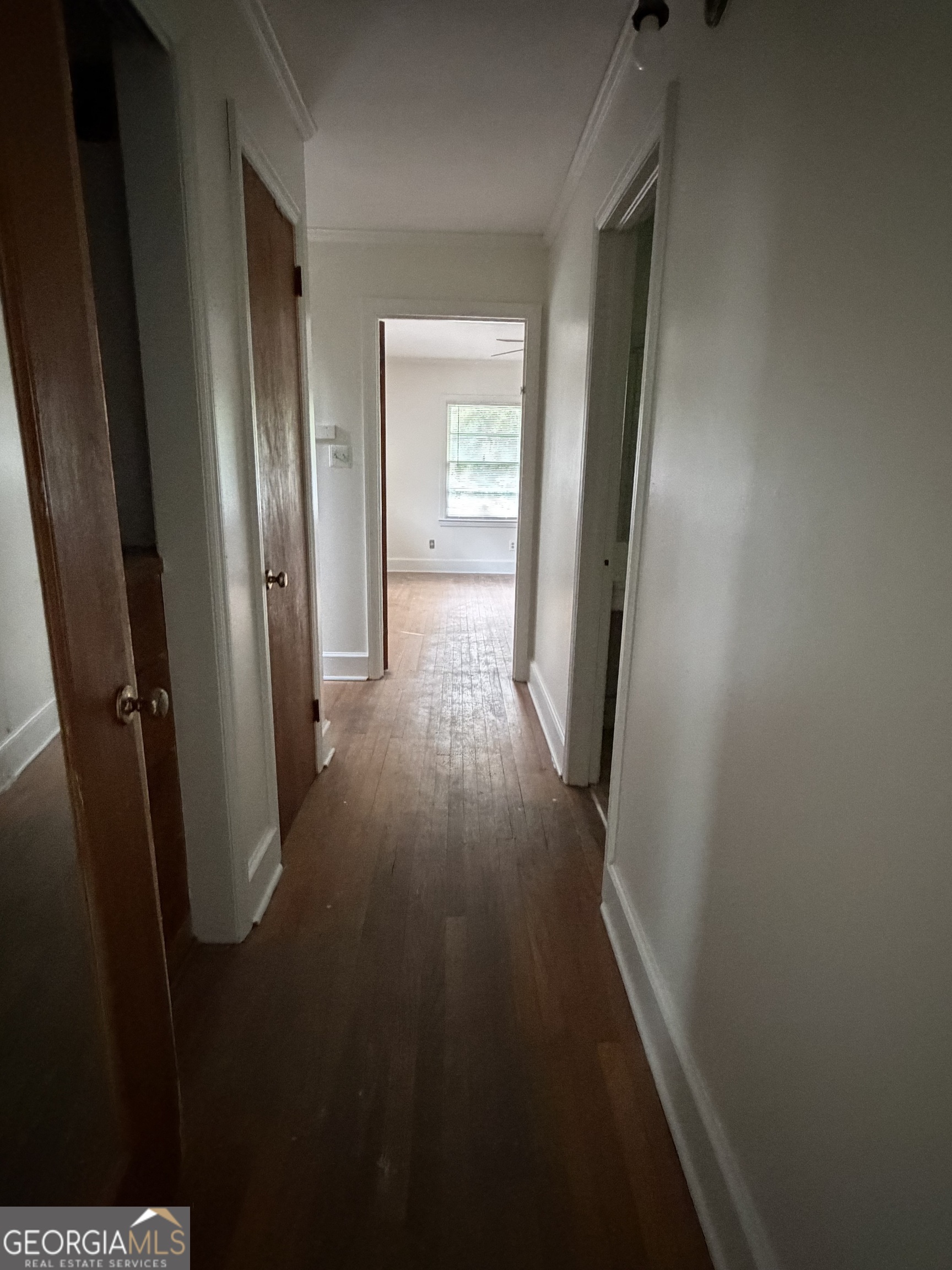 225 West Jessamine Street Fitzgerald, GA 31750 - Photo 25 of 39 wooden floor in a gallery