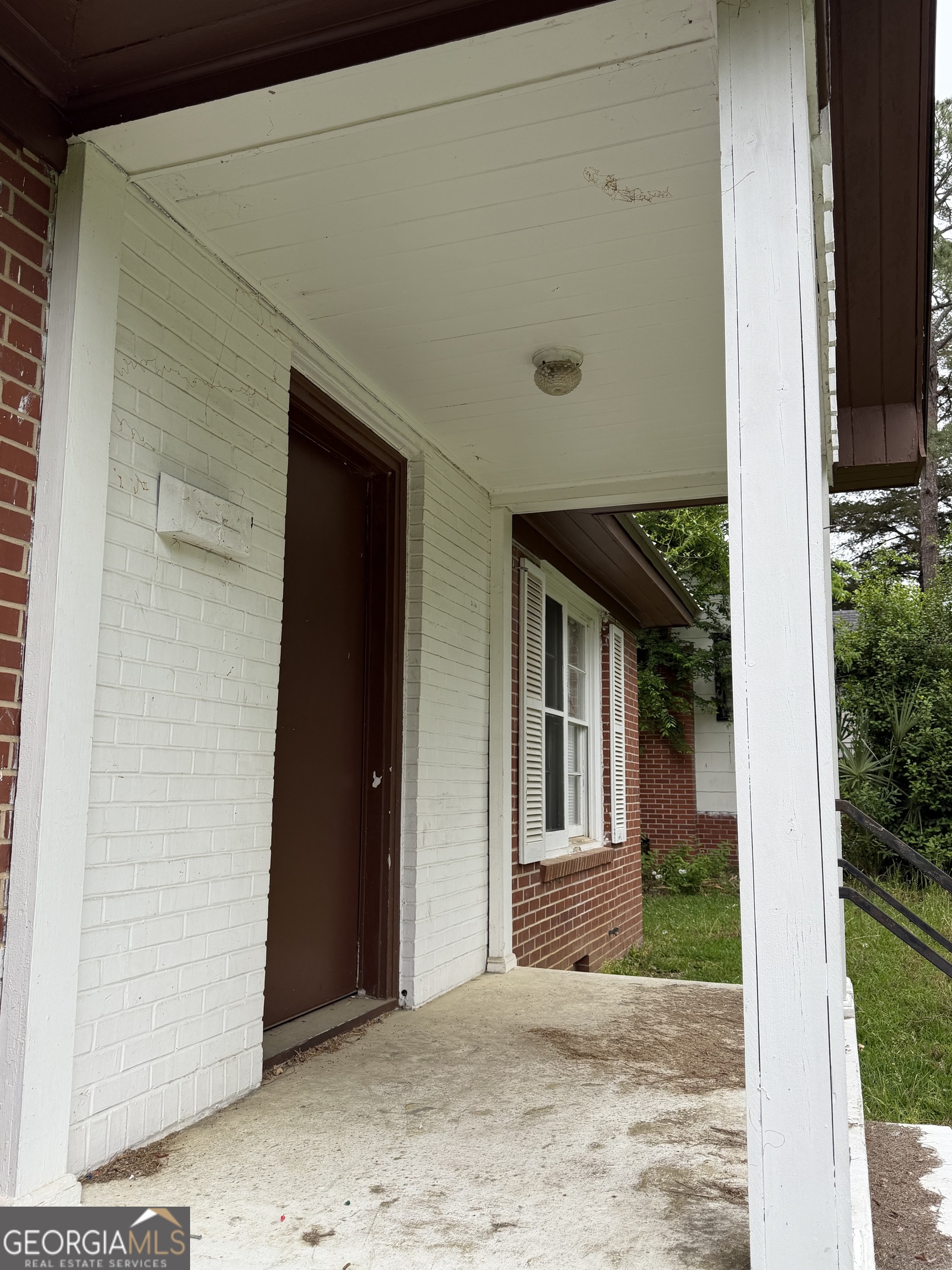 225 West Jessamine Street Fitzgerald, GA 31750 - Photo 7 of 39 a view of a house with backyard porch