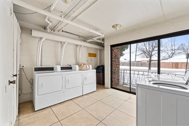 a view of a cars park in front of a building