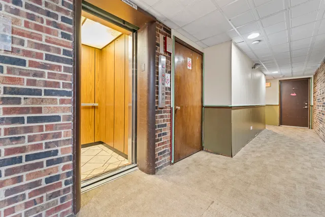 a view of an empty room and a window