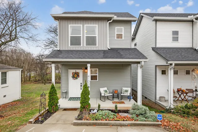a front view of a house with garden