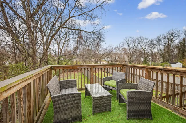 a view of a chair and table in the balcony
