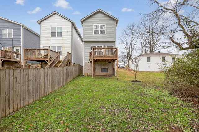 a view of a front of house with a yard