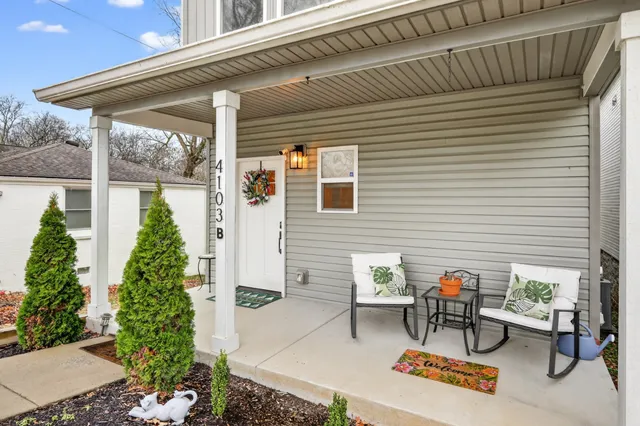 a backyard of a house with outdoor seating