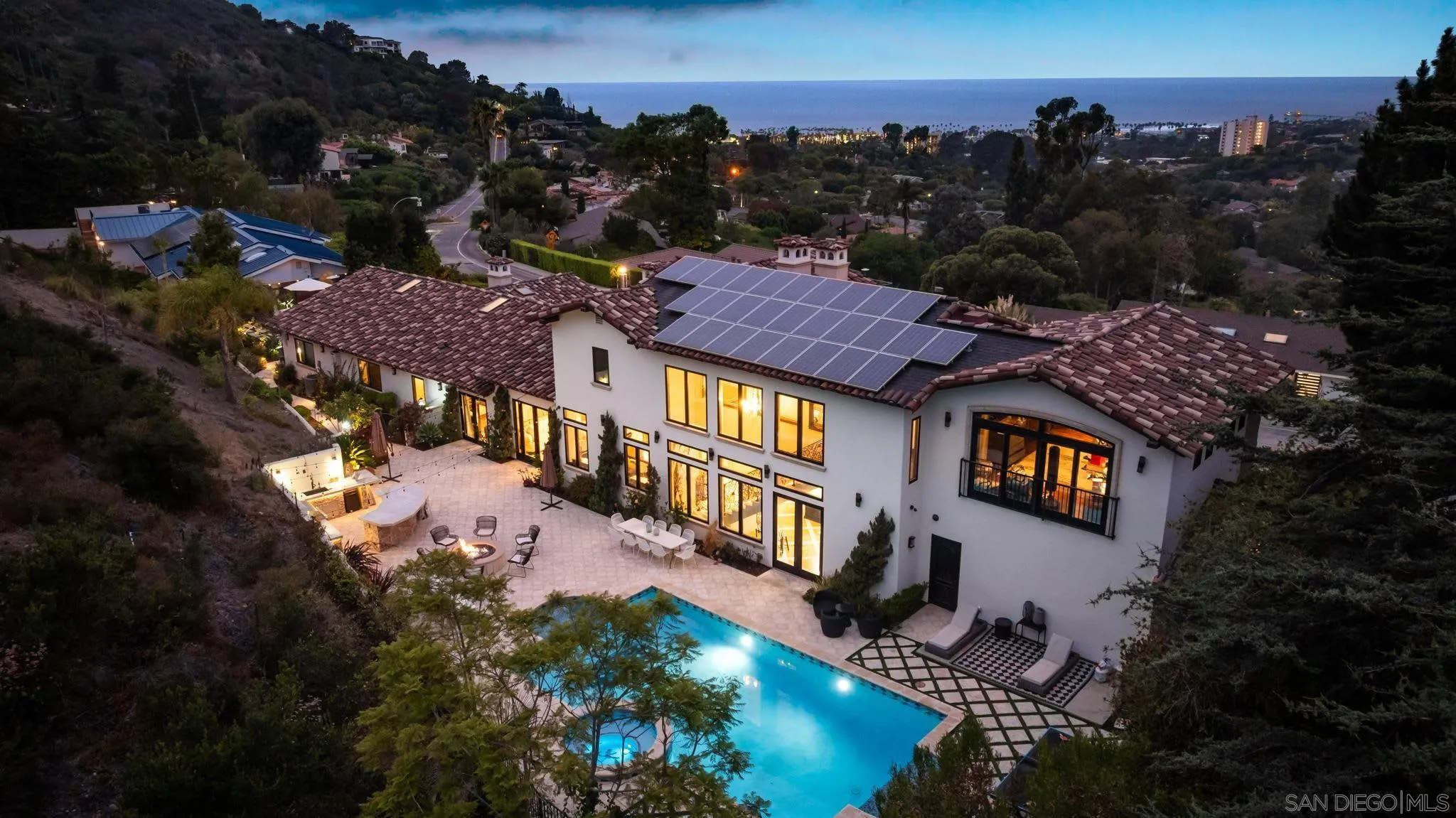 7853 Via Capri La Jolla, CA 92037 - Photo 12 of 67 a view of a house with a yard potted plants and a large tree