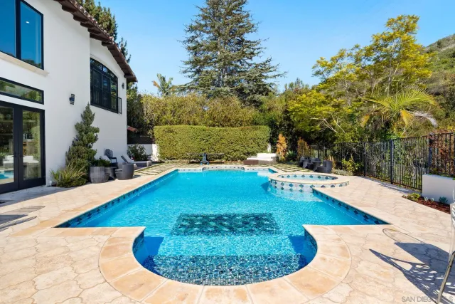 a view of a patio with a table and chairs