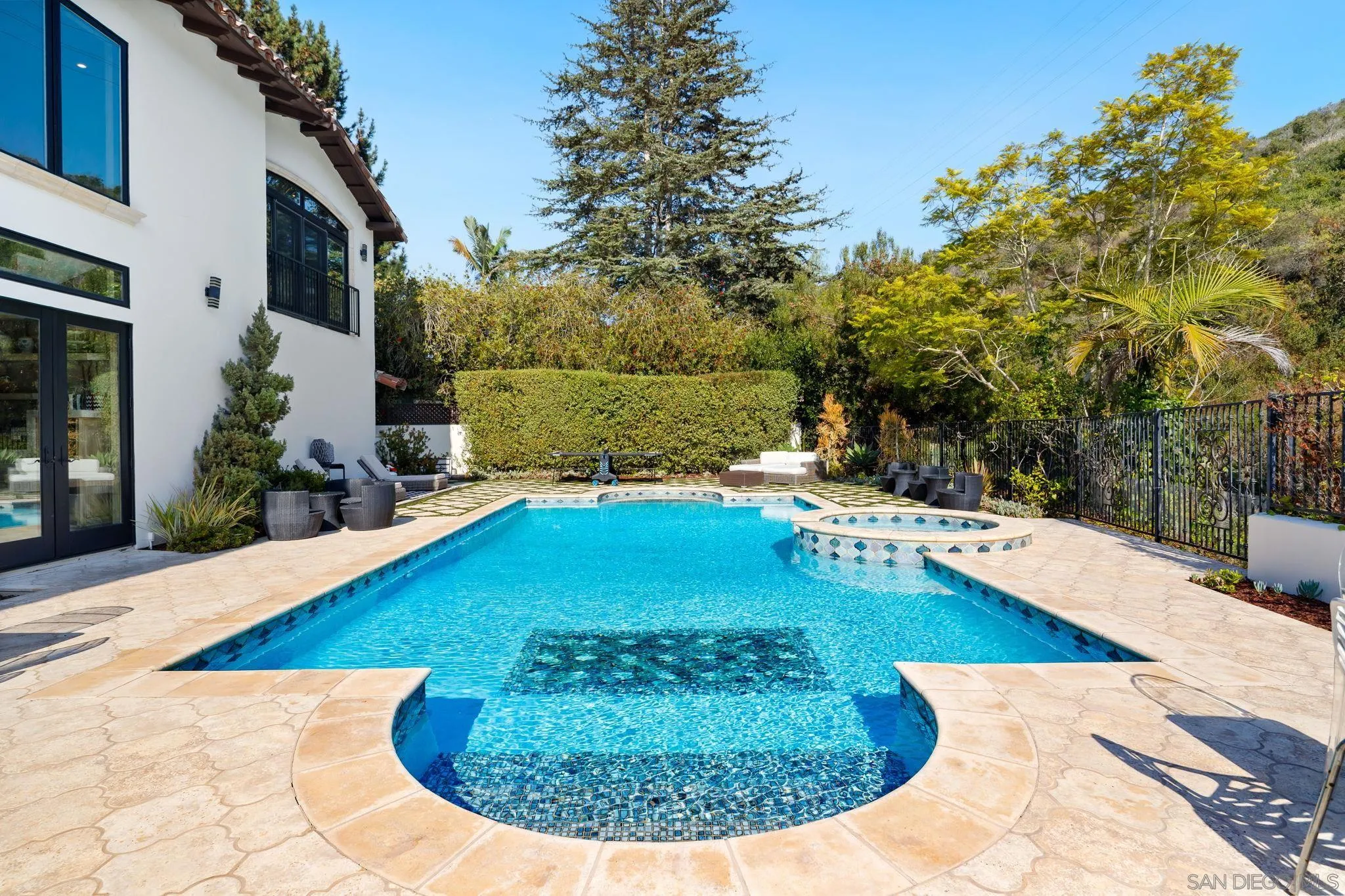 7853 Via Capri La Jolla, CA 92037 - Photo 16 of 67 a view of a swimming pool with an outdoor space
