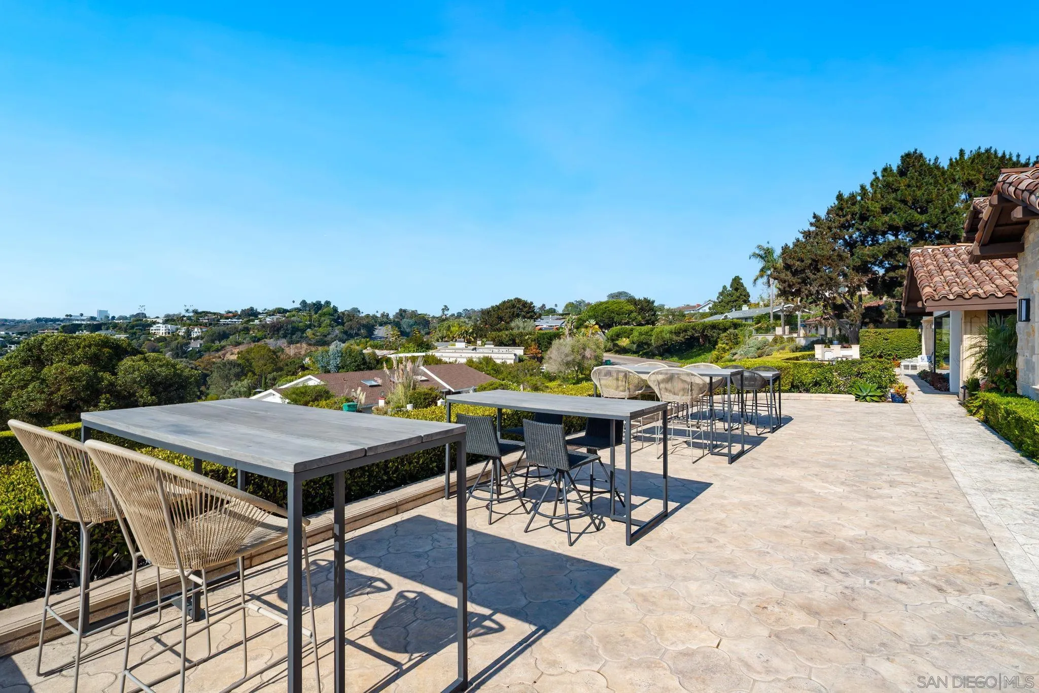 7853 Via Capri La Jolla, CA 92037 - Photo 24 of 67 a view of a patio with a table and chairs