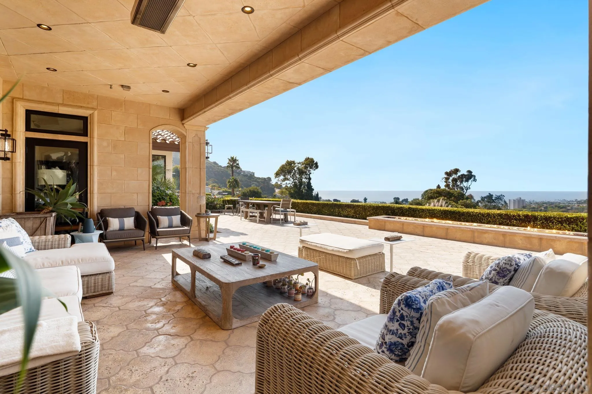 7853 Via Capri La Jolla, CA 92037 - Photo 28 of 67 a living room with furniture and a floor to ceiling window