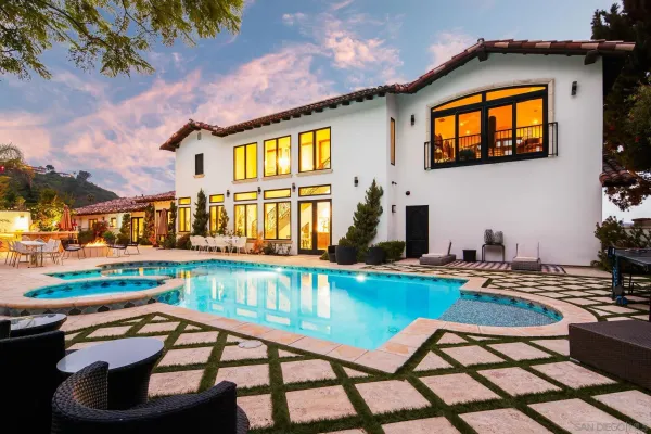 a view of a swimming pool with a lounge chairs