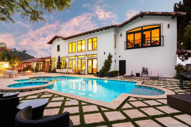 a view of a swimming pool with a lounge chairs