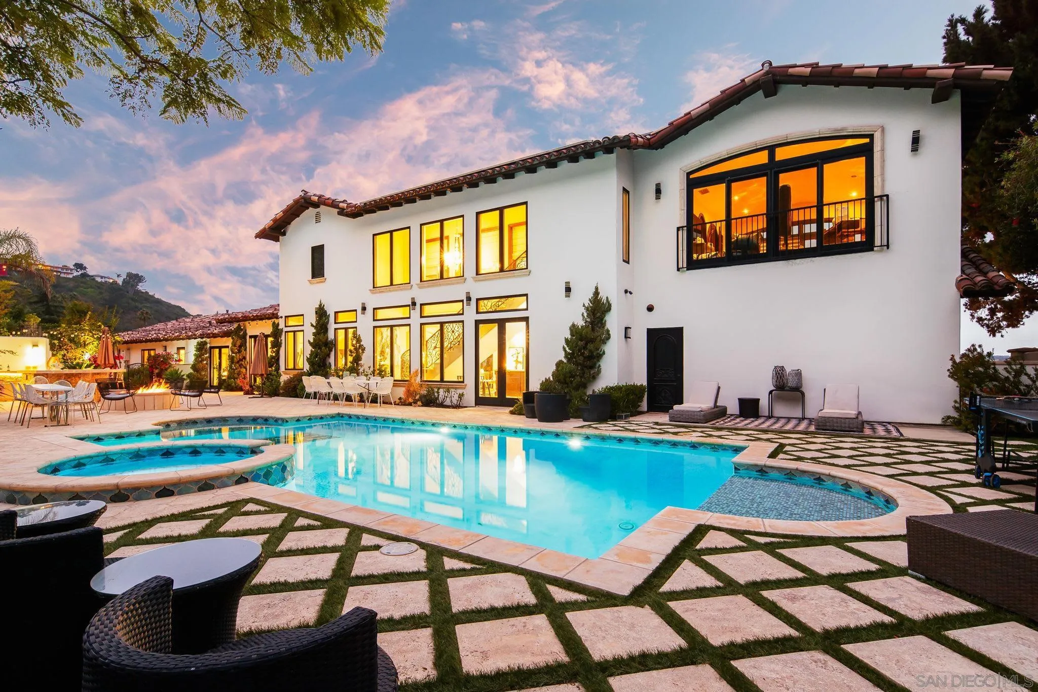 7853 Via Capri La Jolla, CA 92037 - Photo 3 of 67 a view of a swimming pool with a lounge chairs