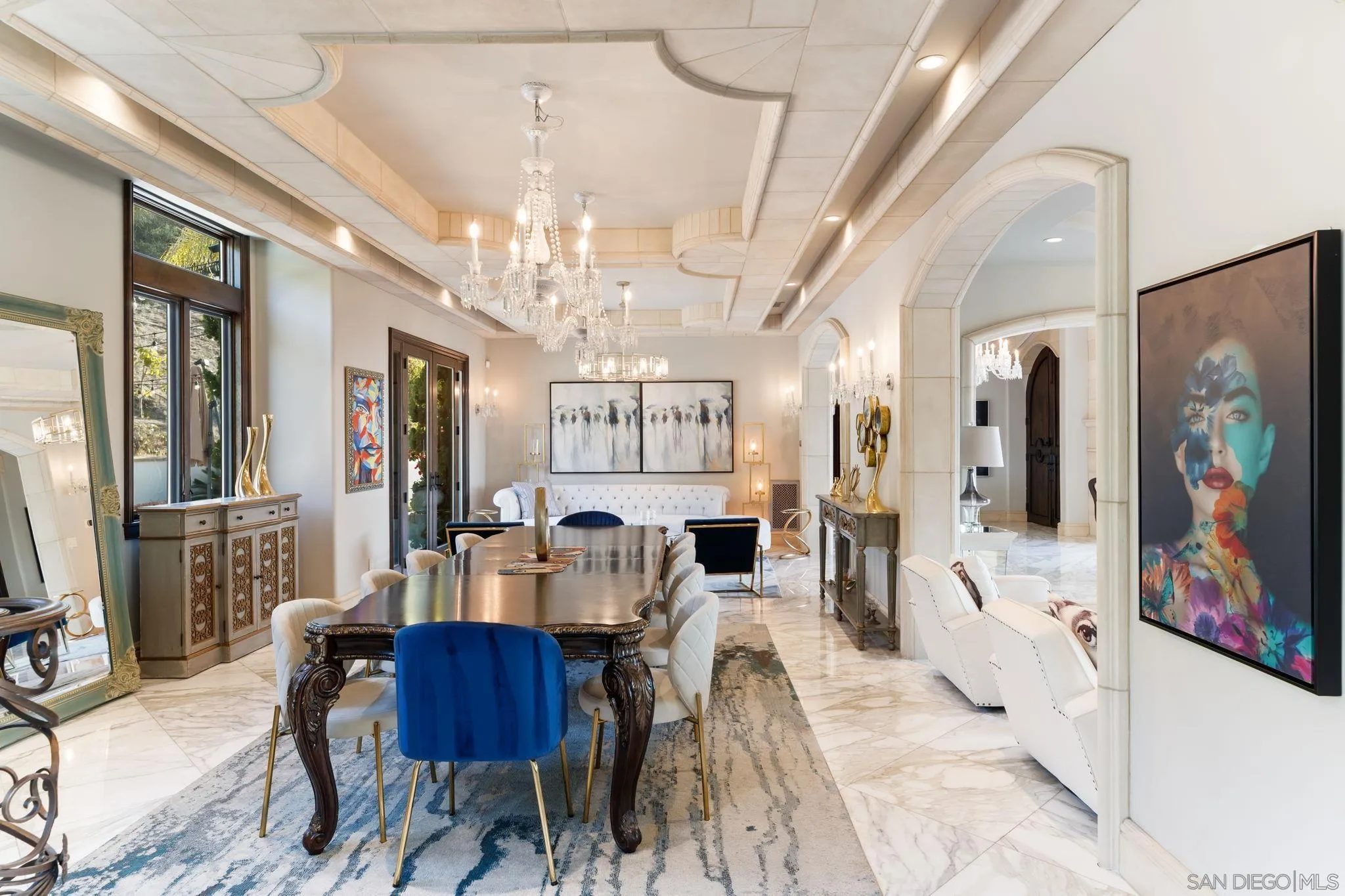7853 Via Capri La Jolla, CA 92037 - Photo 36 of 67 a view of a dining room with furniture and a chandelier