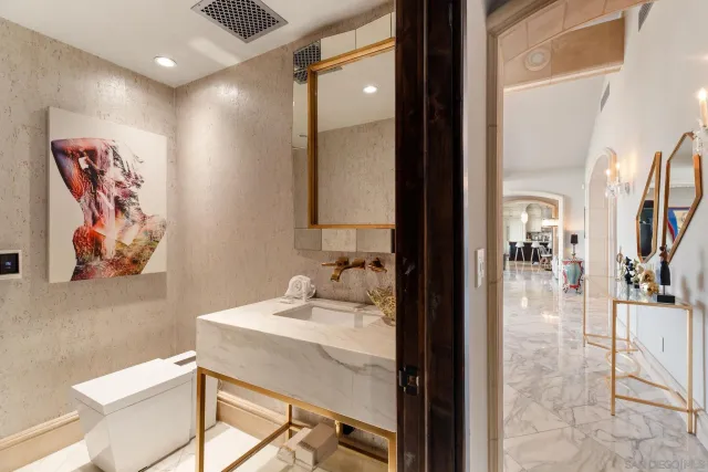 a living room with furniture a large window and wooden floor