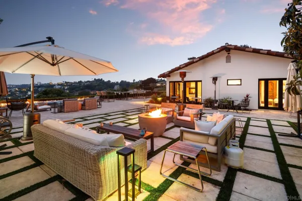 a view of swimming pool with outdoor seating and city view