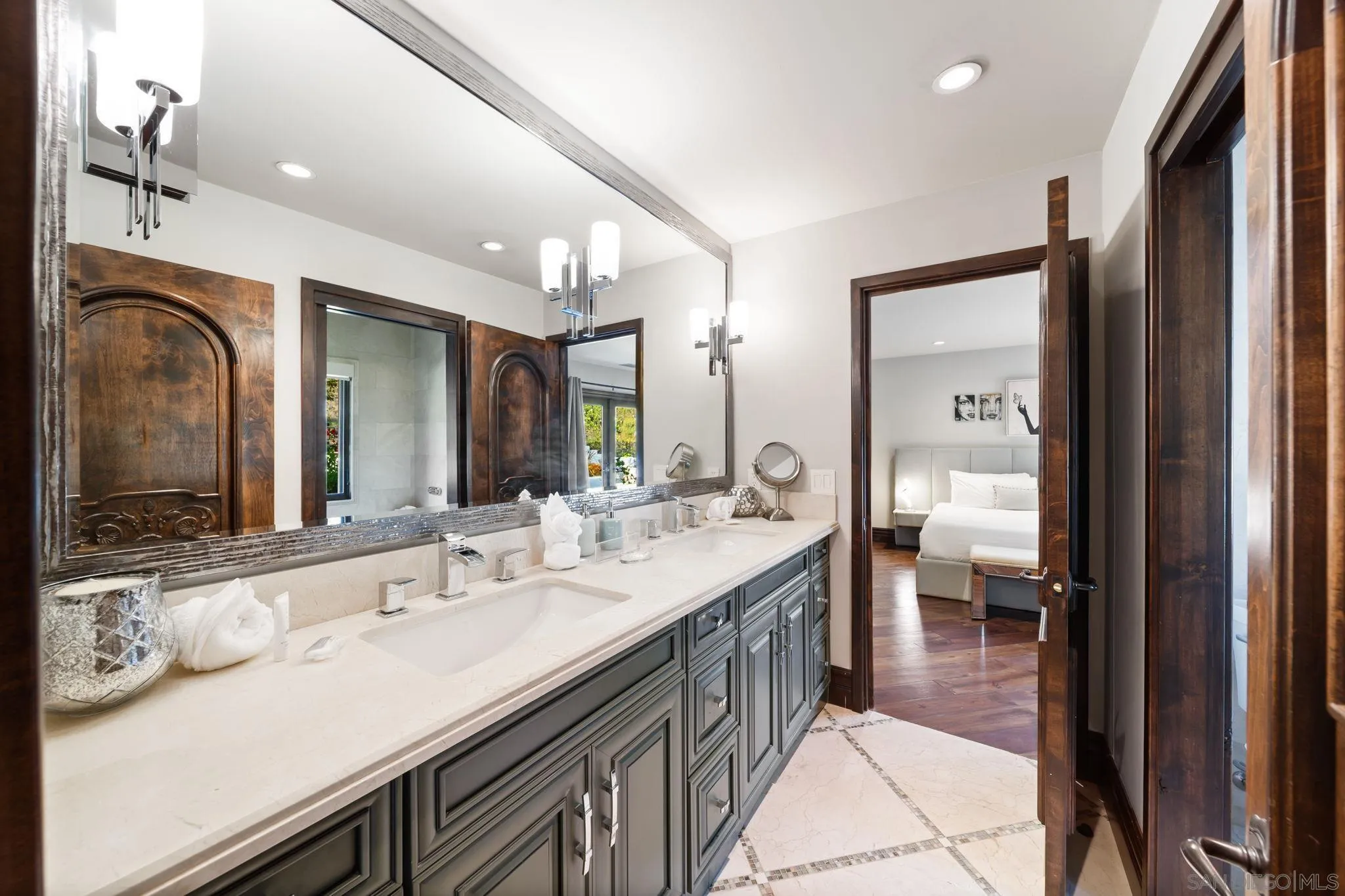 7853 Via Capri La Jolla, CA 92037 - Photo 41 of 67 a en suite bathroom with a sink double vanity and a mirror