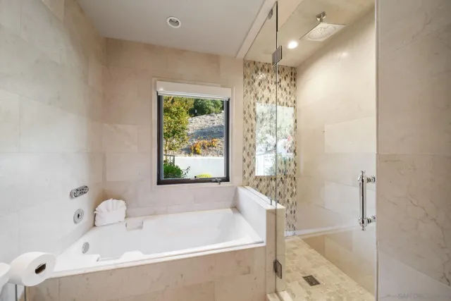 a kitchen with a sink cabinets and window