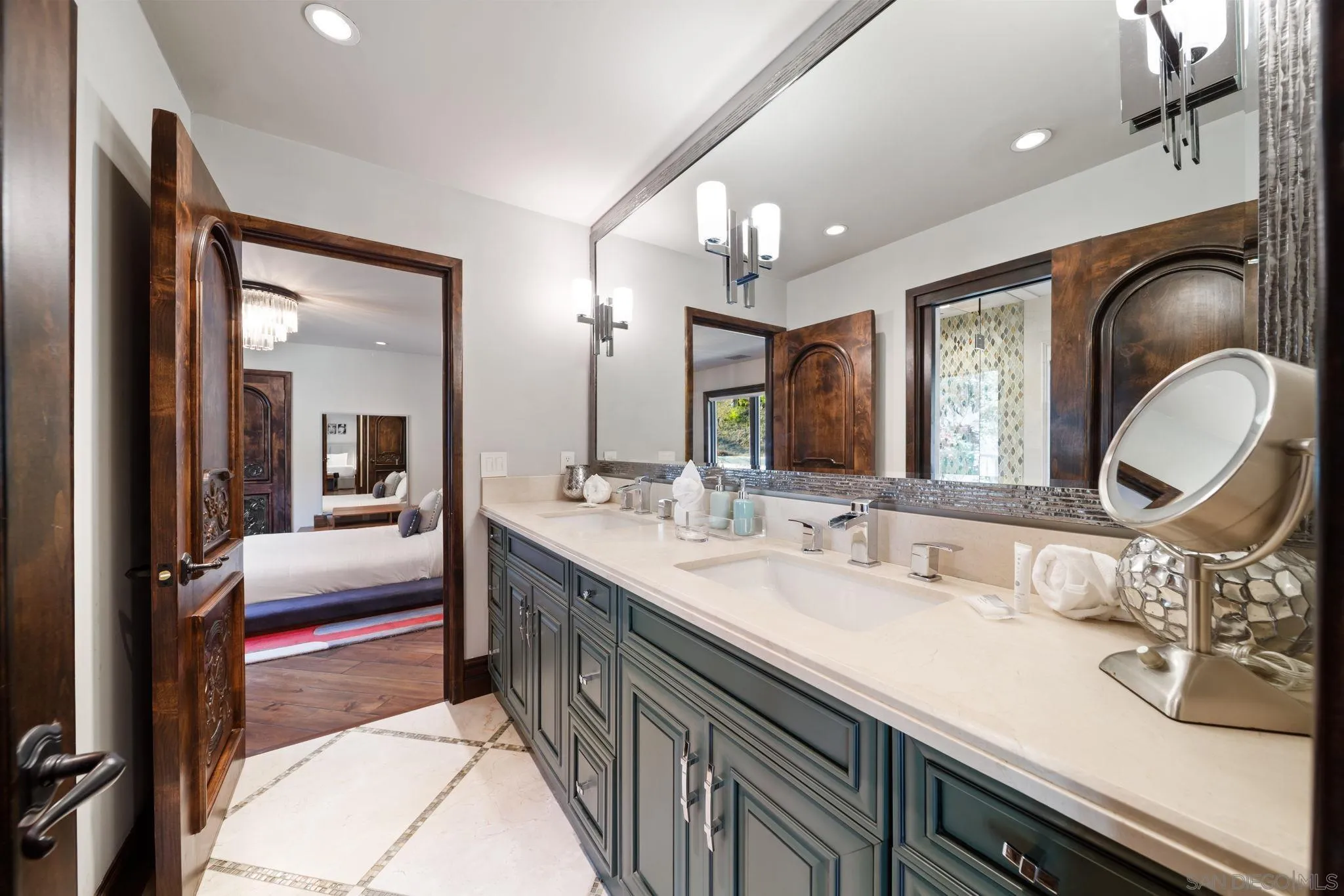 7853 Via Capri La Jolla, CA 92037 - Photo 45 of 67 a en suite bathroom with a double vanity sink and a mirror