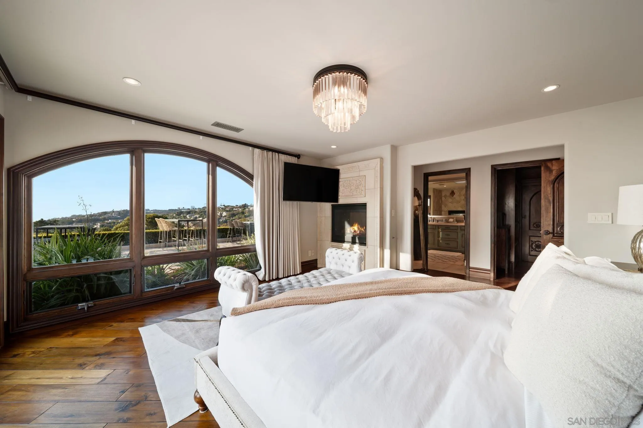 7853 Via Capri La Jolla, CA 92037 - Photo 47 of 67 a large bedroom with a large bed and large windows