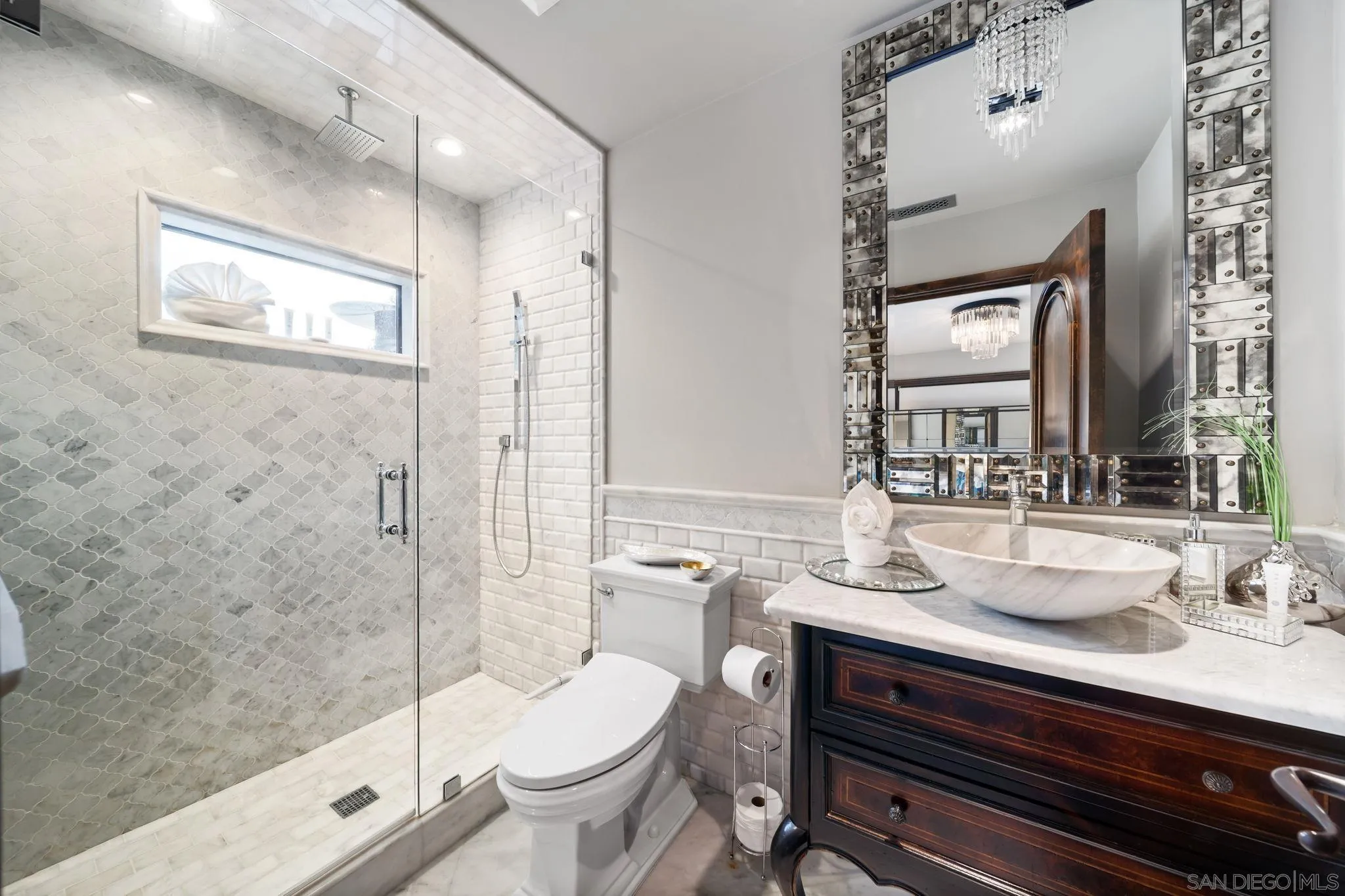 7853 Via Capri La Jolla, CA 92037 - Photo 52 of 67 a bathroom with a sink a toilet and shower