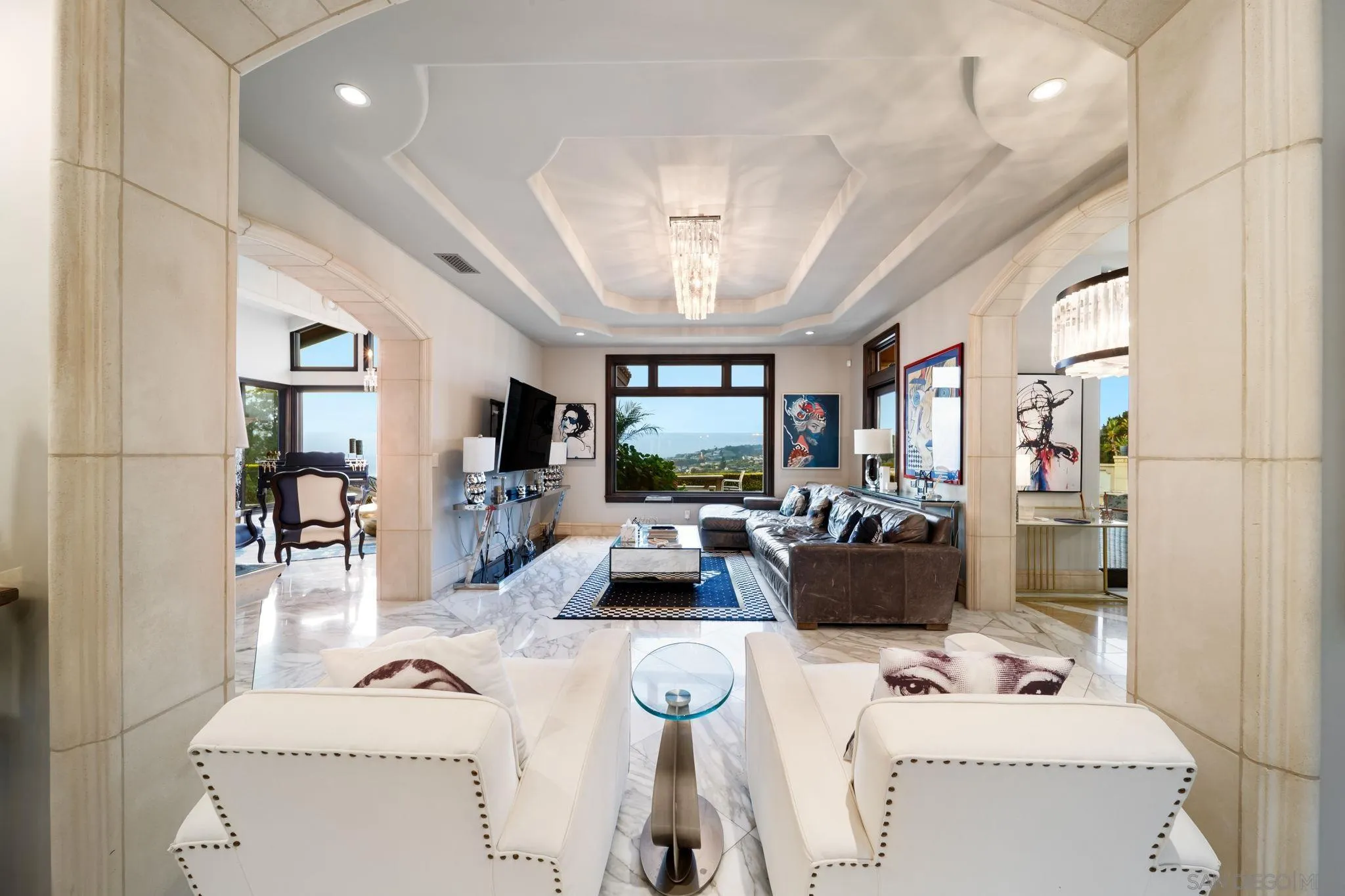7853 Via Capri La Jolla, CA 92037 - Photo 55 of 67 a living room with furniture and a large window