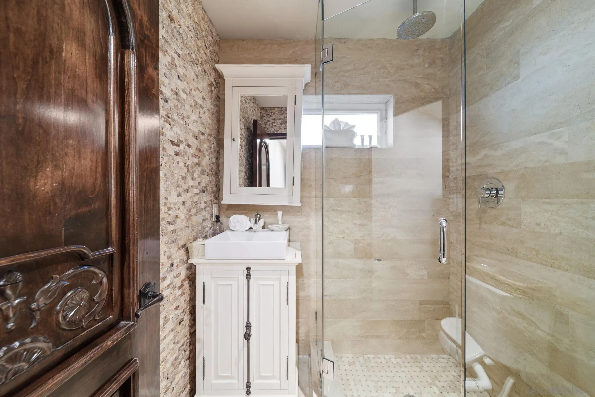 7853 Via Capri La Jolla, CA 92037 - Photo 58 of 67 a bathroom with a bathtub and shower