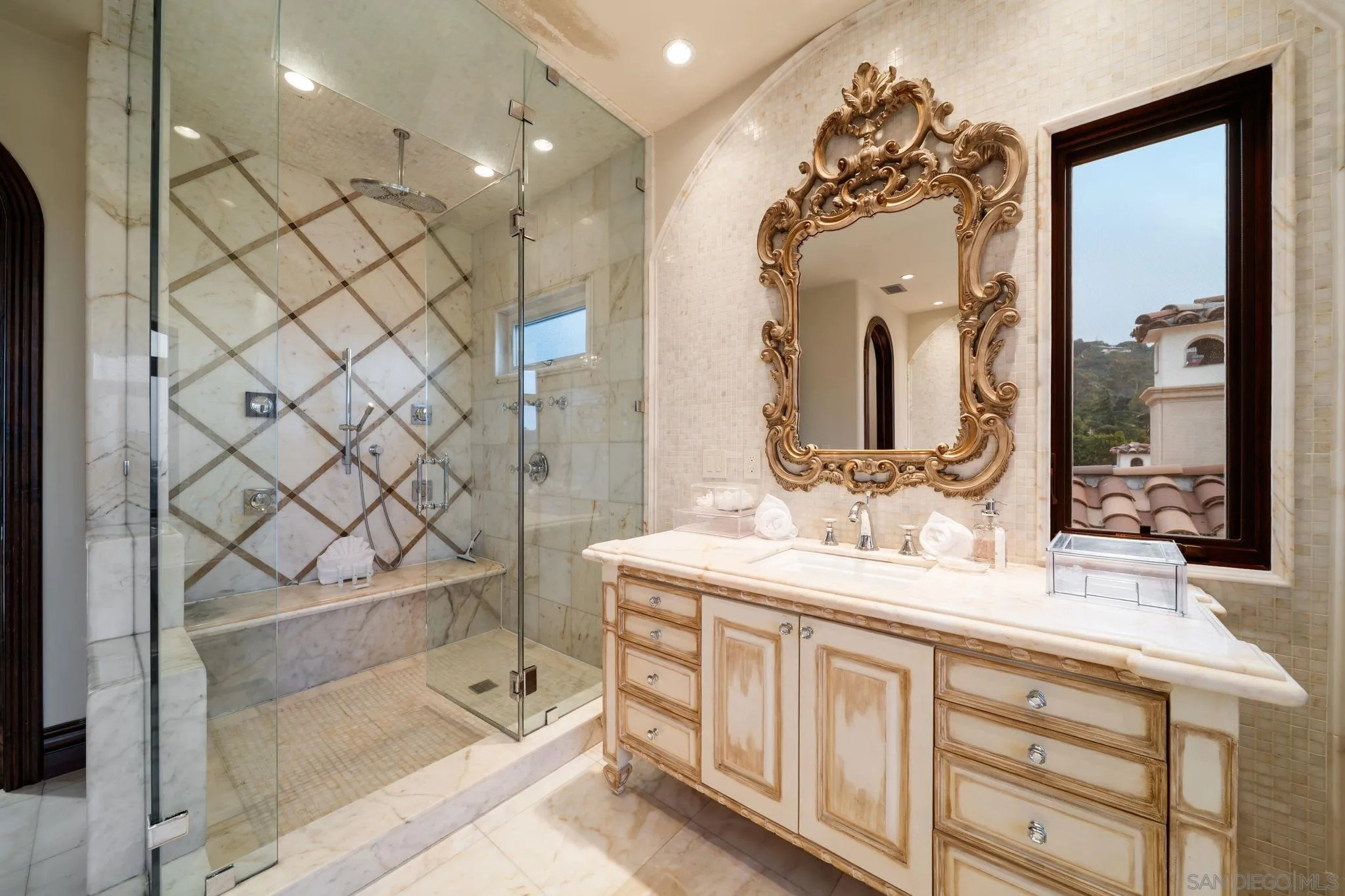 7853 Via Capri La Jolla, CA 92037 - Photo 64 of 67 a bathroom with a double vanity sink mirror and double