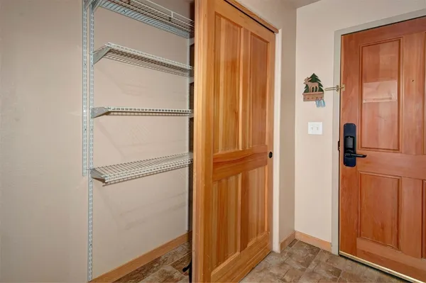 a bathroom with a glass shower door