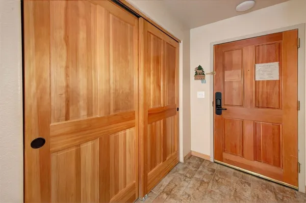 a view of a entryway with wooden walls