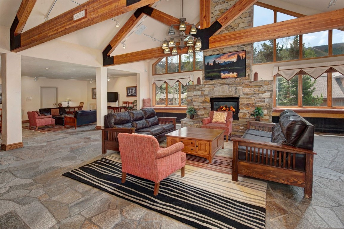 23110 Highway 6, Unit 5062 Keystone, CO 80435 - Photo 21 of 37 a living room with fireplace furniture and a floor to ceiling window