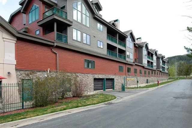 a view of a large building with a mountain in the background