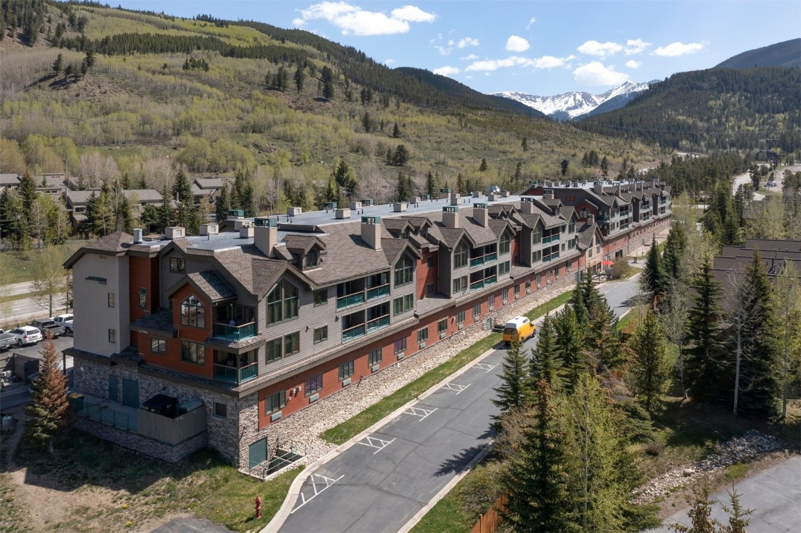 23110 Highway 6, Unit 5062 Keystone, CO 80435 - Photo 30 of 37 a view of a large building with a mountain in the background