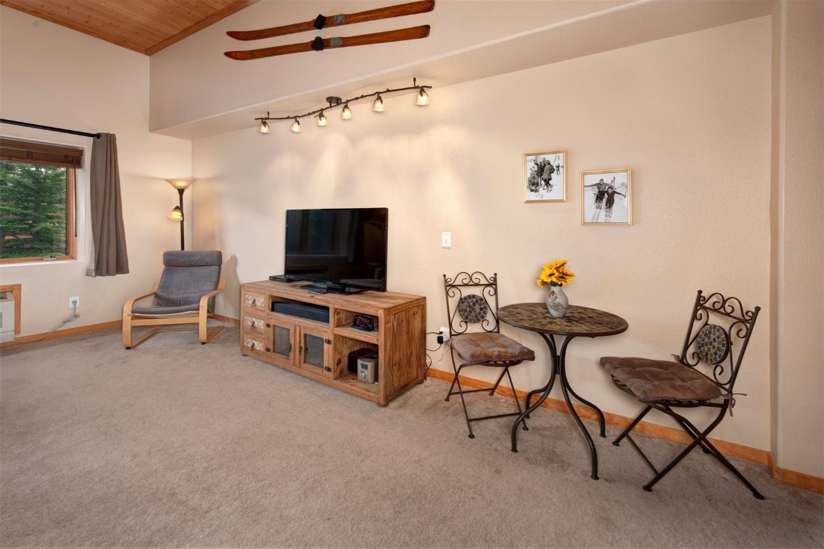 23110 Highway 6, Unit 5062 Keystone, CO 80435 - Photo 4 of 37 a living room with furniture and a flat screen tv