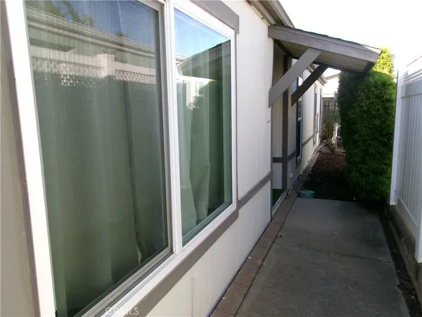 a view of a kitchen from a corridor
