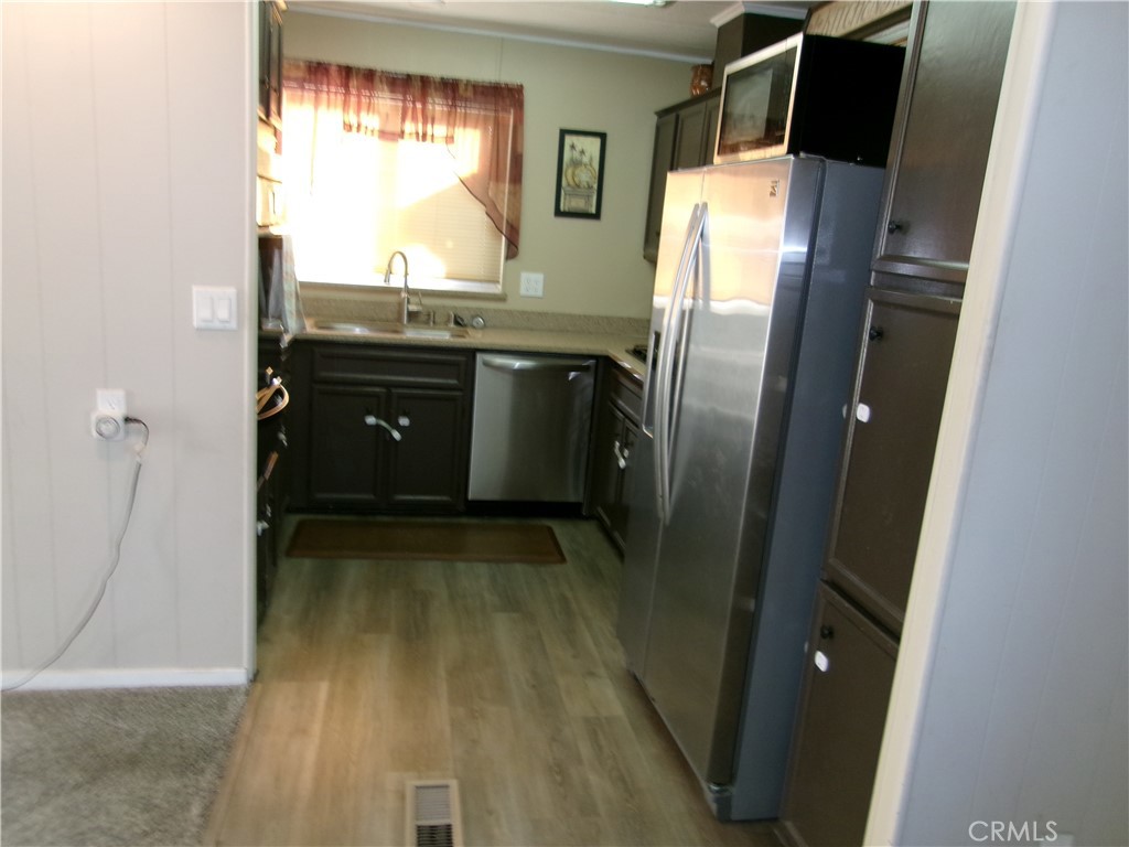 4044 Cherry Hill Road Santa Maria, CA 93455 - Photo 5 of 13 a view of a kitchen from a corridor